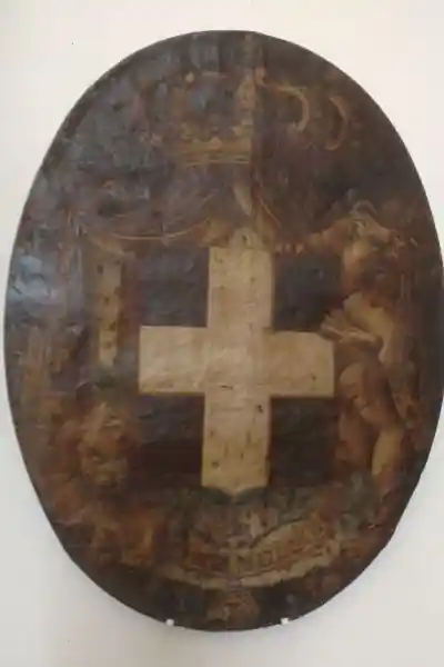 Cross on a shield with lions, Santa Maria della Scala